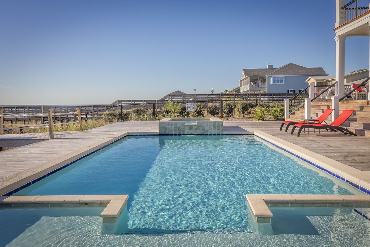 A crystal-clear pool serviced by JC Florida Pool Service